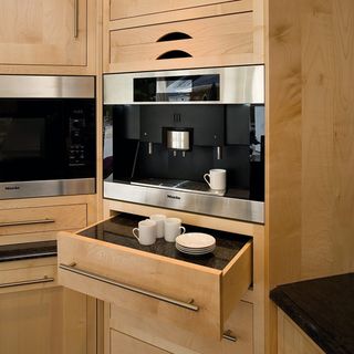 coffee machine with drawers and shelf for cup