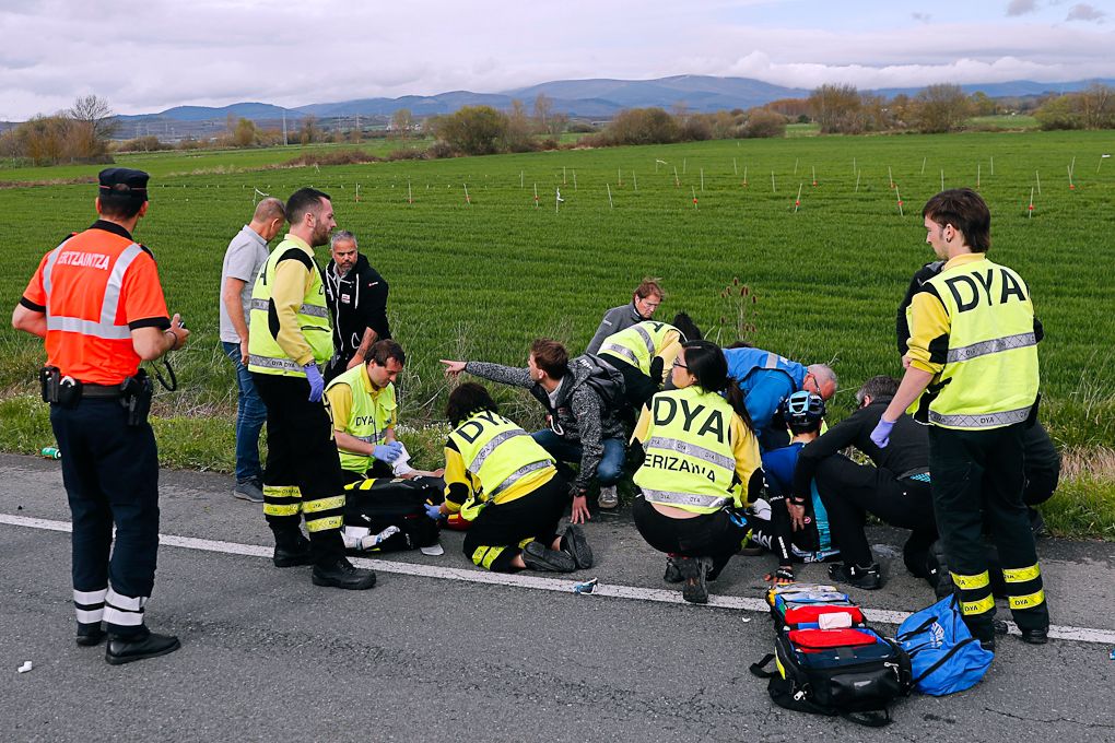 Medical personnel attend riders after a crash with 6km to go in stage 3 at Pais Vasco