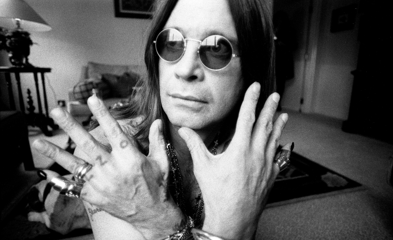 Ozzy Osbourne showing his rings