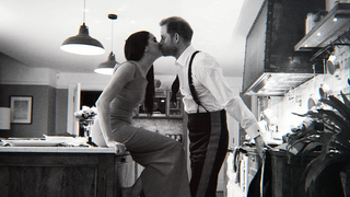 Prince Harry and Meghan, The Duke and Duchess of Sussex kissing in a kitchen