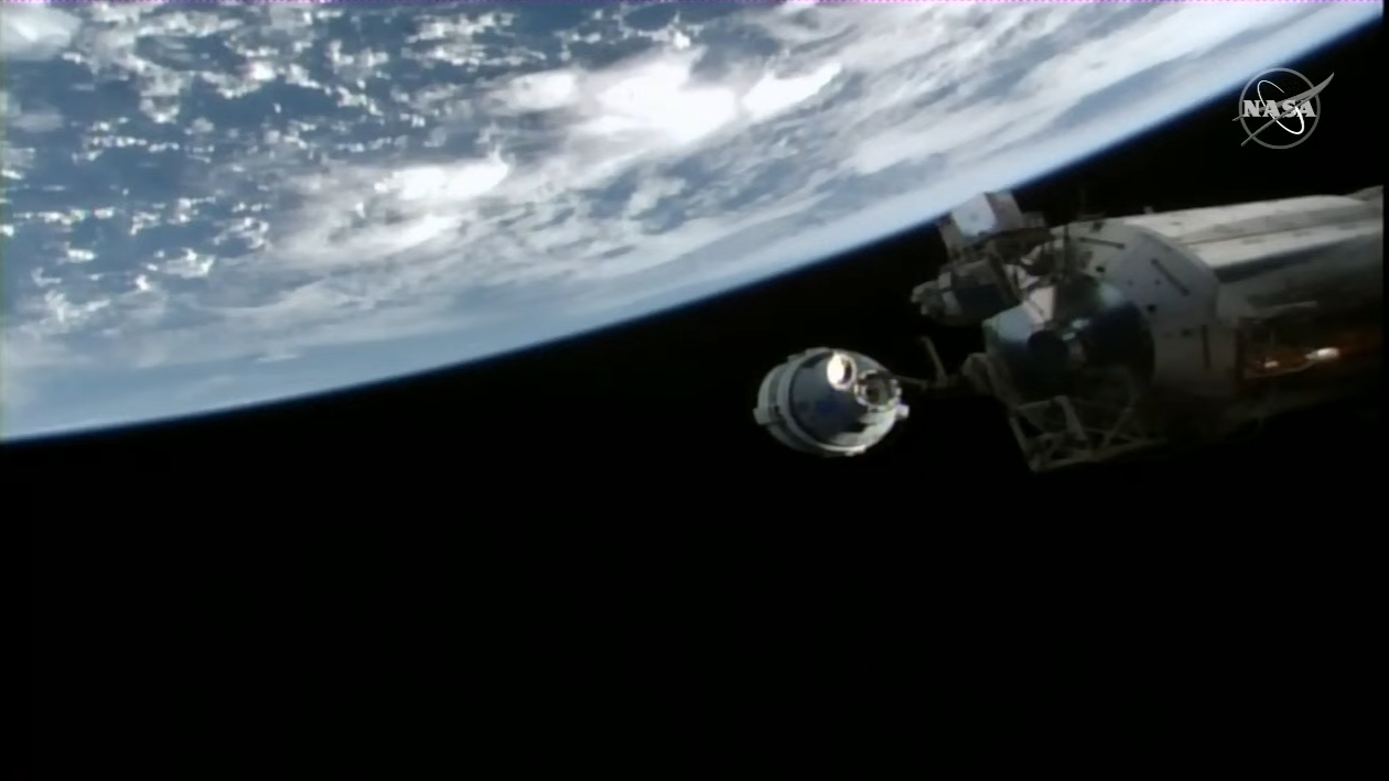 Boeing's Starliner OFT-2 spacecraft sits 10 meters from the International Space Station during its first-ever docking operations on May 20, 2022.