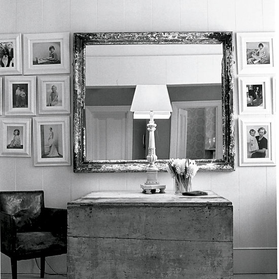 hallway with family portrait mirror