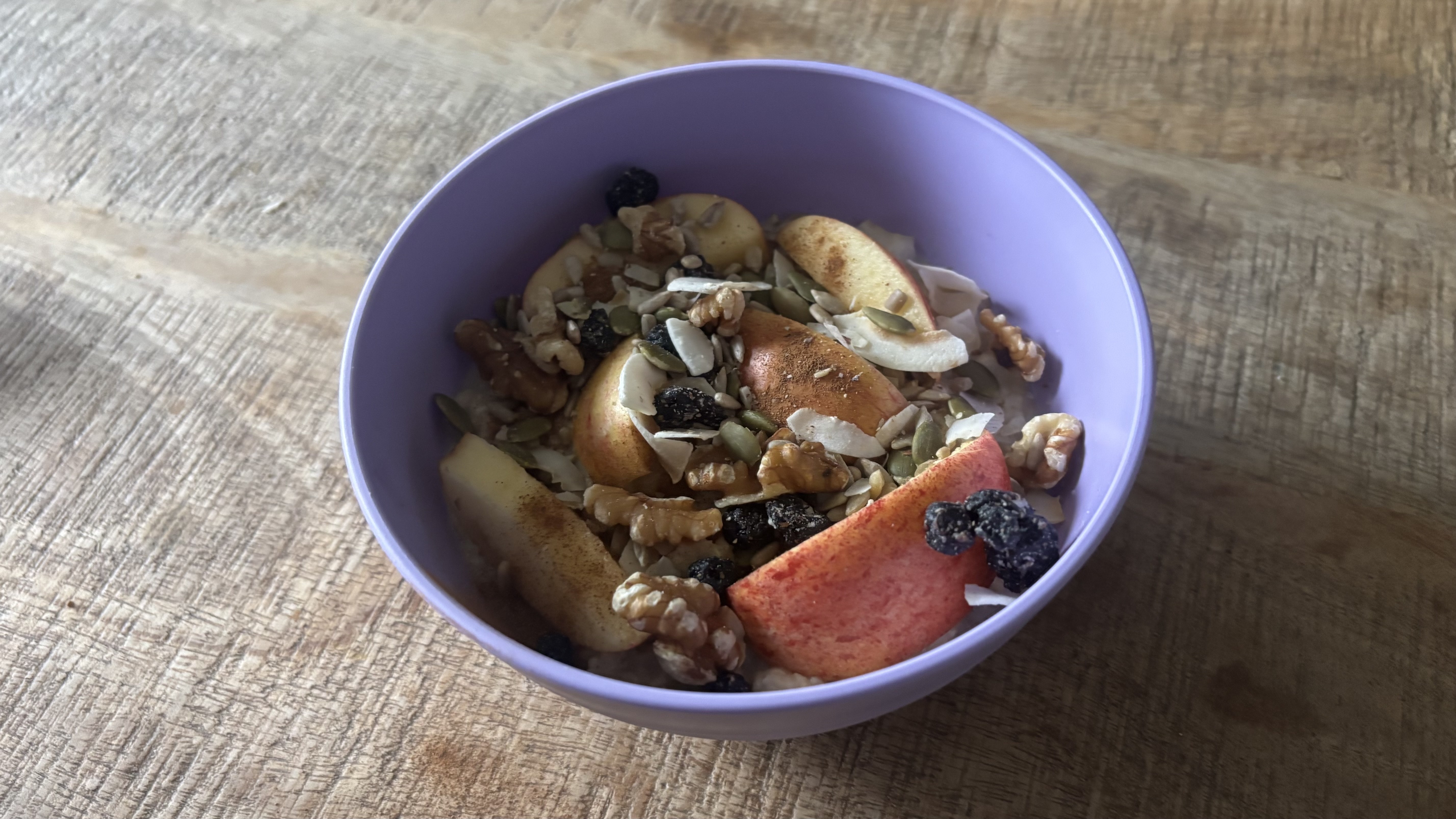 Oatmeal with chopped apples and walnuts.