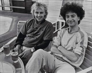 Roger Taylor and John Deacon relaxed backstage
