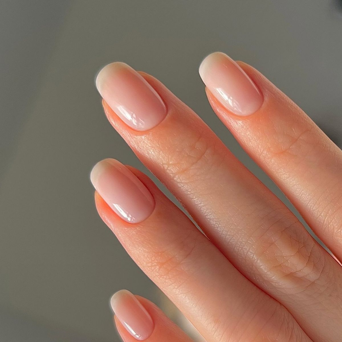 A close-up of a neat, natural-looking manicure