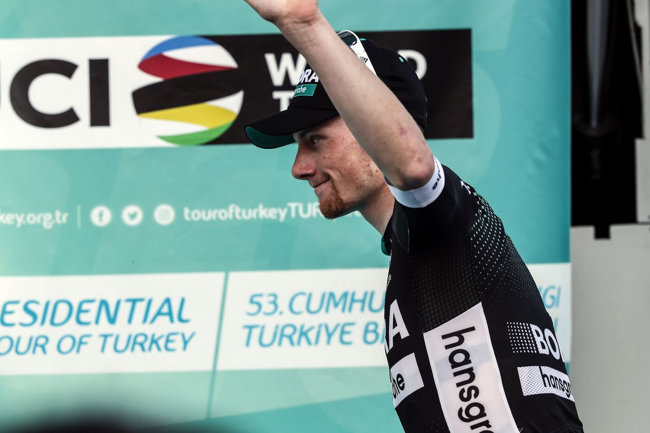Sam Bennett steps onto the podium