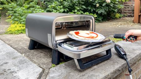Ninja Artisan Outdoor Pizza Oven in a back yard