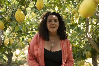 Bettany Hughes happy among the Mediterranean lemon trees.
