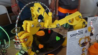 This RepRap 3D printer dubbed Simpson has taken a divergence from common designs by having three arms.