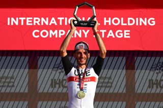 JEBEL HAFEET UNITED ARAB EMIRATES FEBRUARY 26 Adam Yates of United Kingdom and UAE Team Emirates celebrates at podium as stage winner during the 5th UAE Tour 2023 Stage 7 a 153km stage from Hazza Bin Zayed Stadium to Jebel Hafeet 1029m UAETour UCIWT on February 26 2023 in Jebel Hafeet United Arab Emirates Photo by Dario BelingheriGetty Images