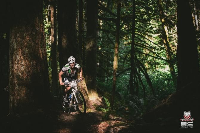 Steve Dempsey climbs under the cool canopy of Canada's west coast Rainforest.