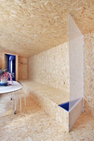 a micro apartment overed in osb