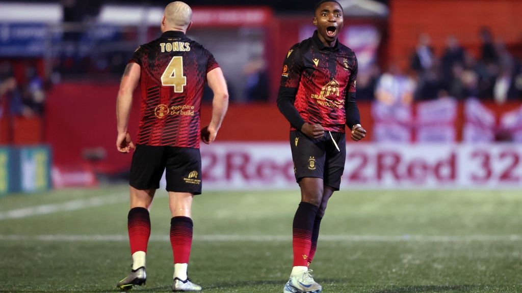 Beck-Ray Enoru and Tom Tanks of Tamworth celebrate at the final whistle after winning the Emirates FA Cup First Round match between Tamworth and Huddersfield Town at The Lamb Ground on November 01, 2024 in Tamworth, England.