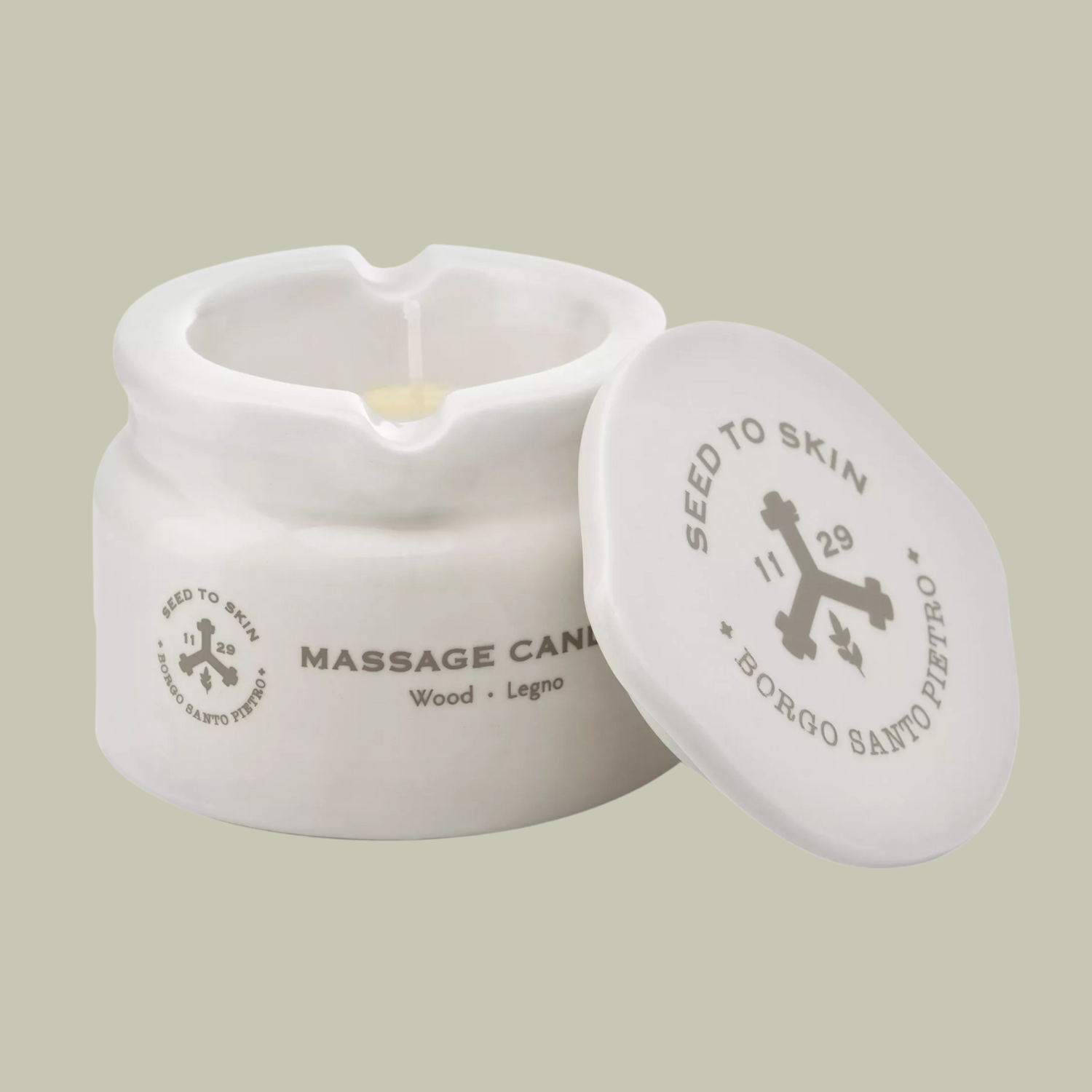 A ceramic massage candle with a lid