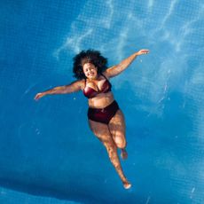 woman floating in a pool