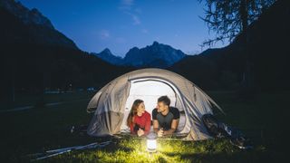 reasons you need a camping lantern: couple with lantern