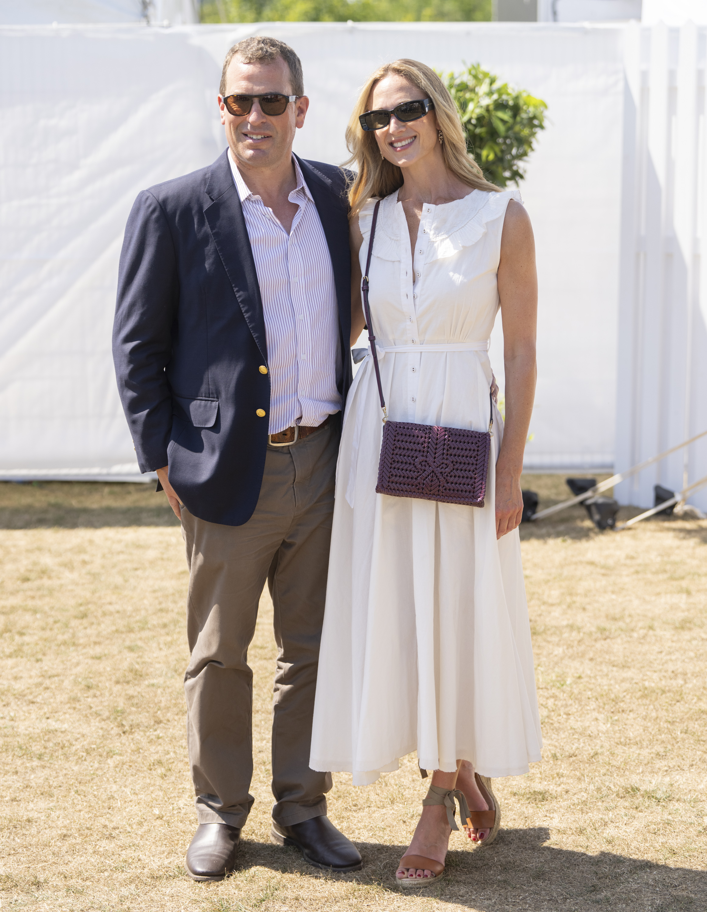 Harriet Sperling in a white dress standing with Peter Phillips