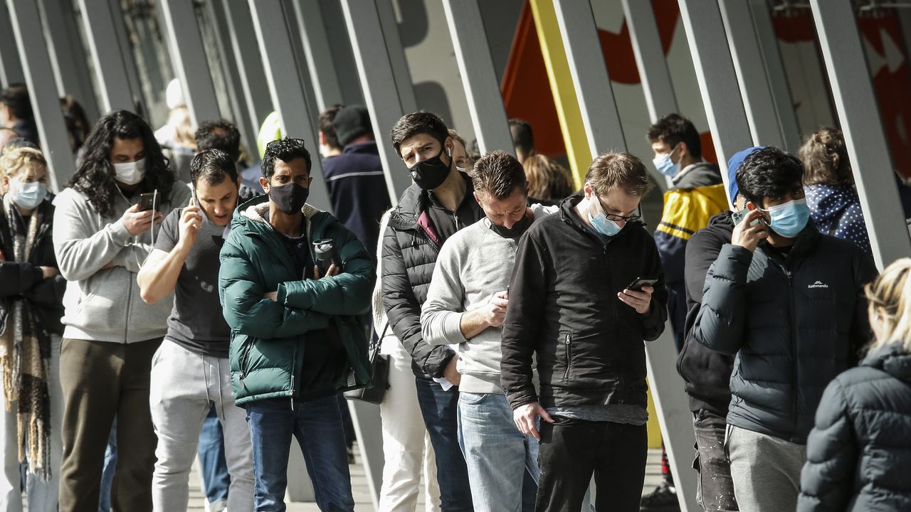 Australians queue for vaccination outside the Melbourne Exhibition Centre