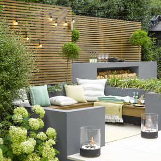 grey outdoor living room with white cushions