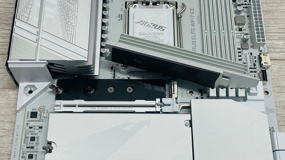 A Gigabyte Aorus Elite motherboard with the SSD heatsinks removed.