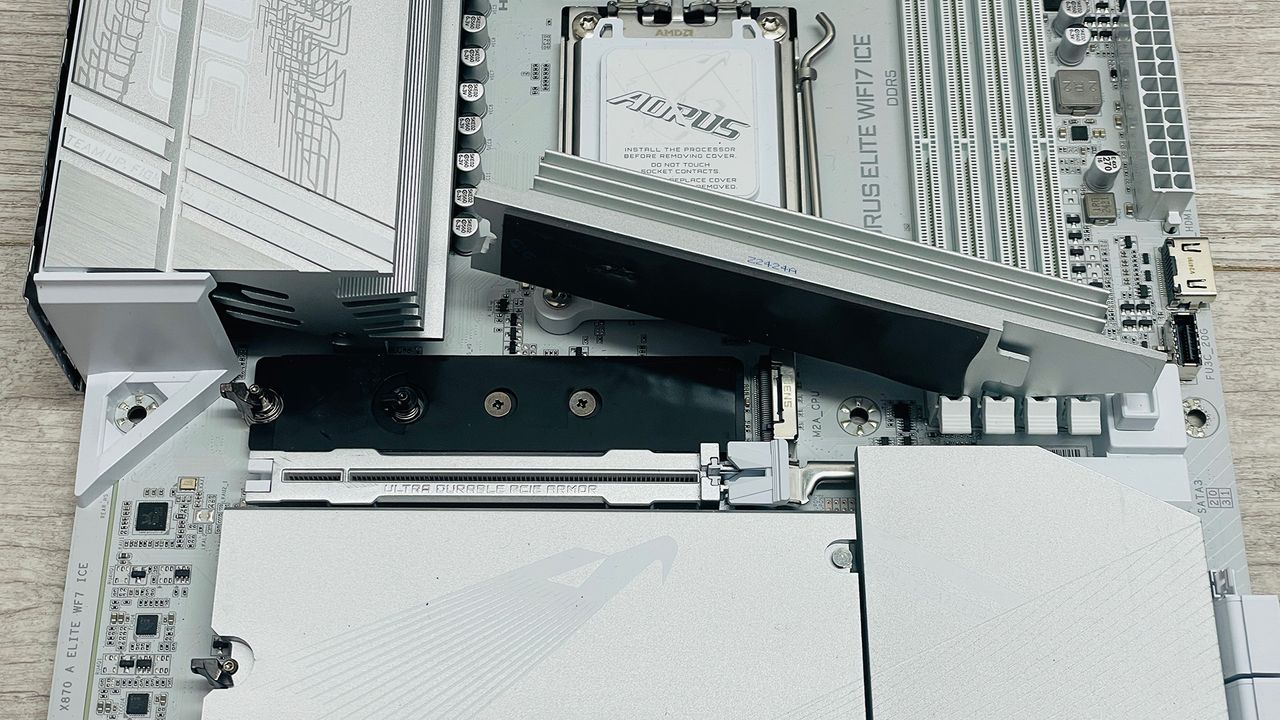 A Gigabyte Aorus Elite motherboard with the SSD heatsinks removed.