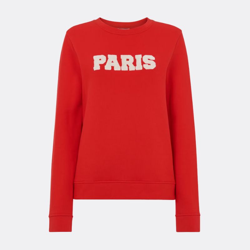 A cutout of a red Whistles sweatshirt with Paris slogan