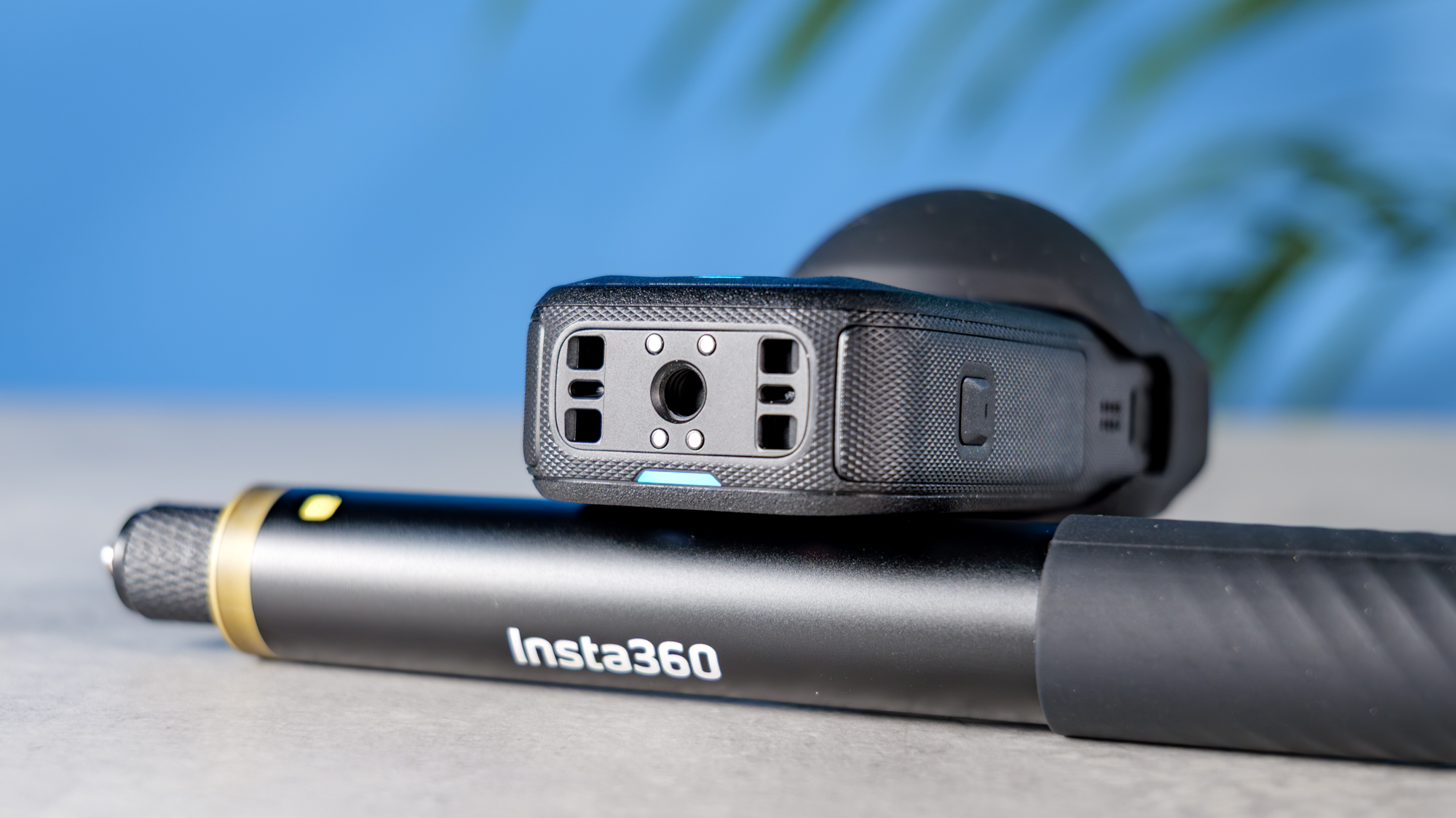 A photo of the Insta360 X6 base, resting on a selfie stick