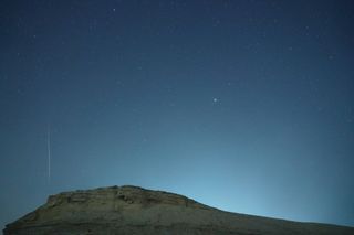 A meteor streaks across the night sky in Bazhou, Xinjiang Province, China, in the early morning of December 14, 2021.