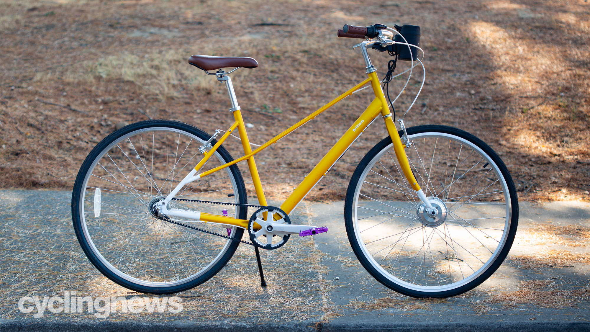 Swytch Electric Bike Conversion Kit installed on yellow city bike