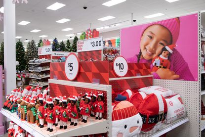 Shelves in Target stocked with Christmas decorations. 