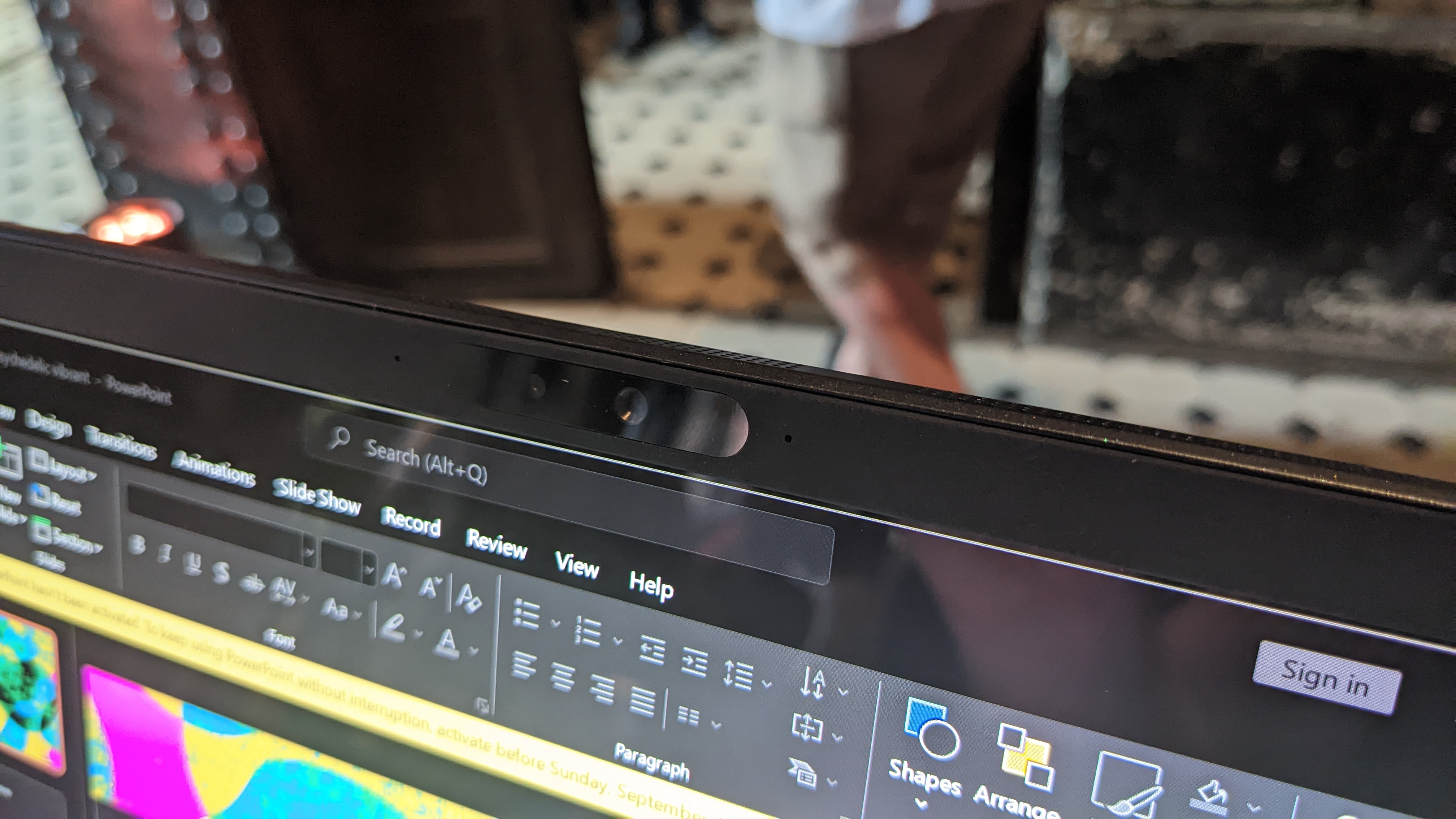 Asus Zenbook 17 Fold OLED foldable laptop on a desk at the Asus launch event.