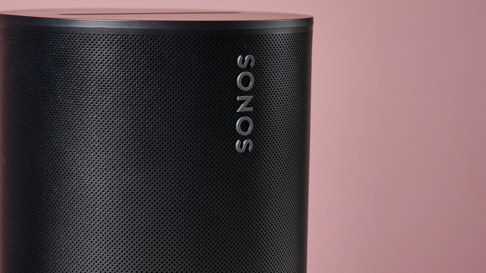 A closeup of the front of the Sonos Era 100, showing its logo.