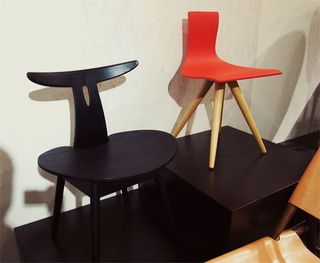 Black and red chair, both in different styles