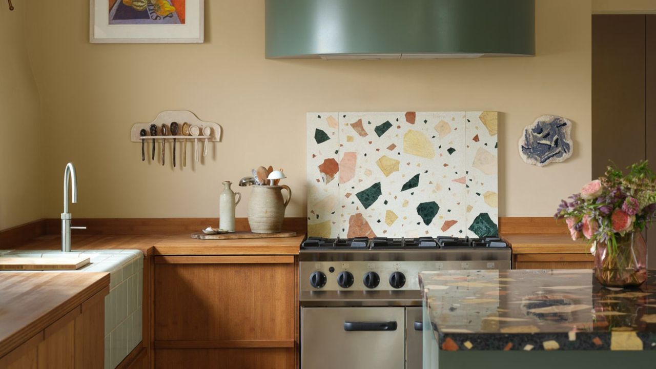 retro kitchen with beige walls, patterned backsplash, wooden cabinets