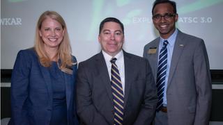 WKAR GM Susi Elkins and Dean Prabu David of the College of Communication Arts and Sciences pose with FCC Commissioner Michael O’Rielly (center). Photo MSU Today