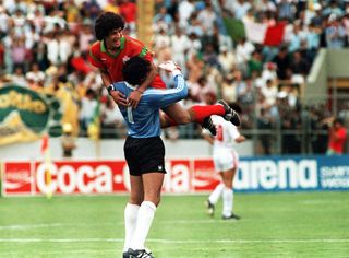 Moroccan goalkeeper Zaki Badou celebrates with team-mate Mustapha Biaz during the 1986 World Cup.