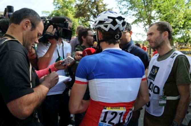 French national champion Arnaud Demare talks to the press after stage 1