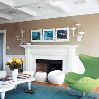 living room with fireplace with armchair