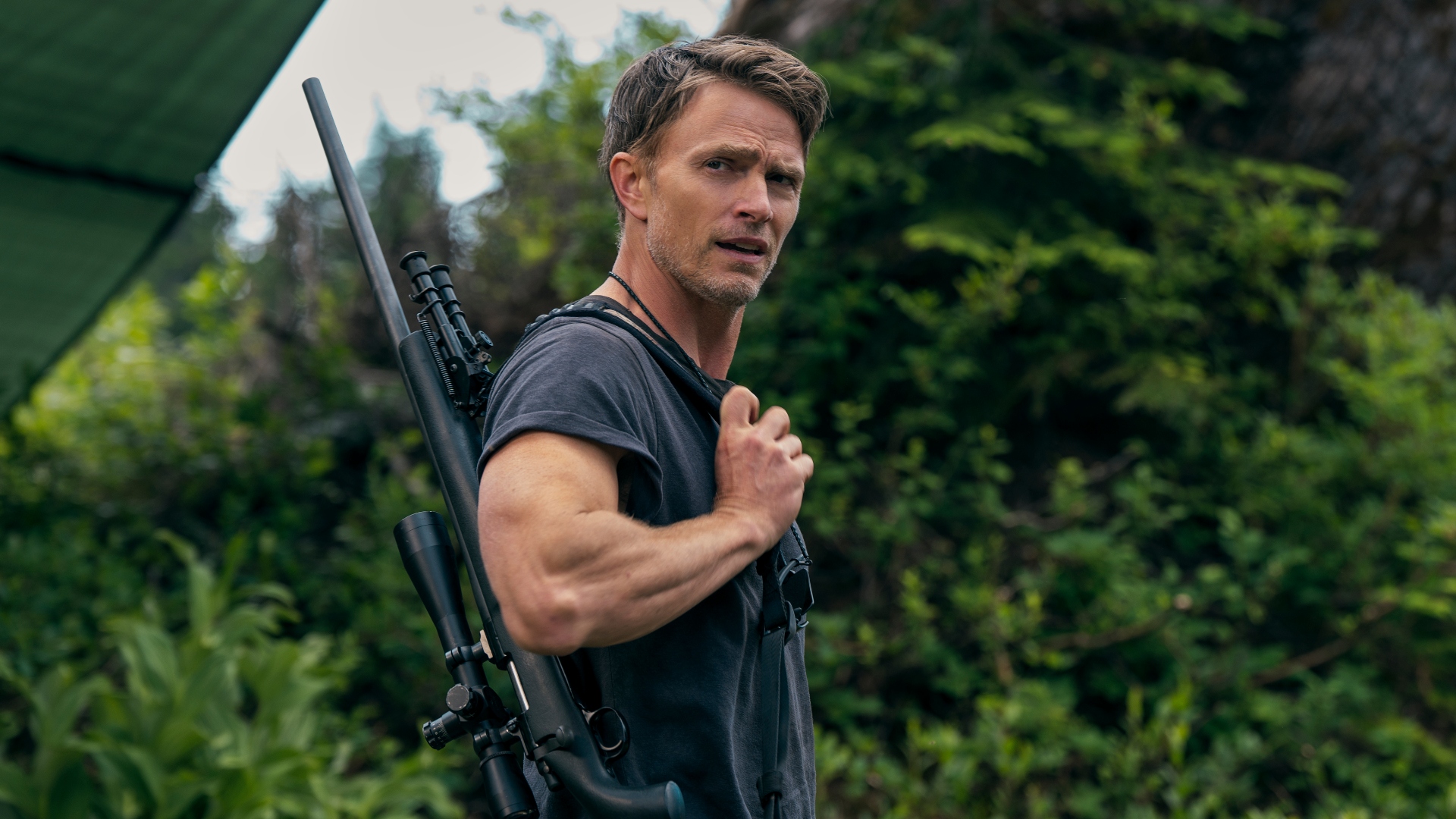 Shane holds his gun on his shoulder in Untamed