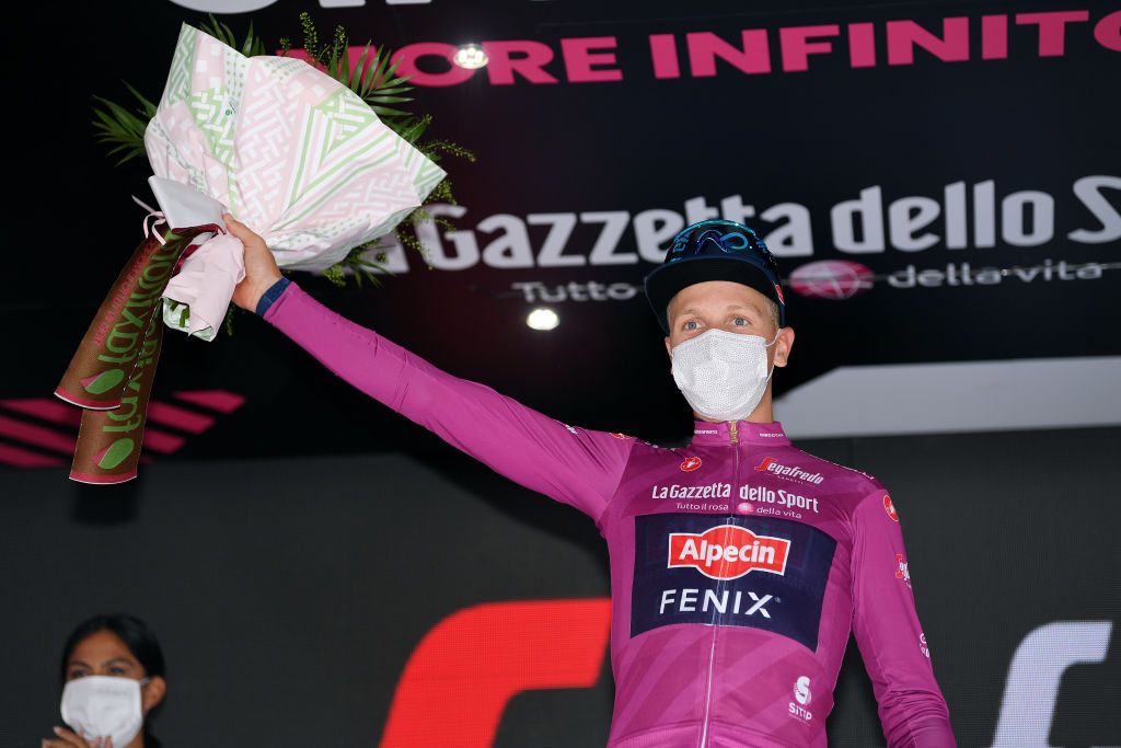 NOVARA ITALY MAY 09 Tim Merlier of Belgium and Team AlpecinFenix Purple Points Jersey celebrates at podium during the 104th Giro dItalia 2021 Stage 2 a 179km stage from Stupinigi Nichelino to Novara Mask Covid Safety Measures girodiitalia Giro UCIworldtour on May 09 2021 in Novara Italy Photo by Tim de WaeleGetty Images