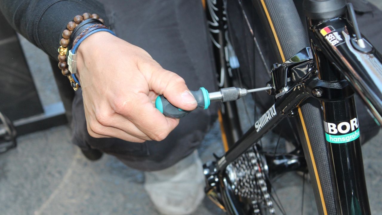 A Bora mechanic dials in a direct-mount caliper
