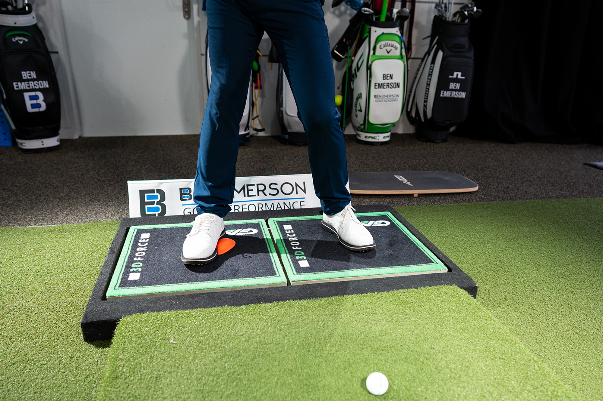 Ben Emerson demonstrating how to load effectively into the trail foot and hip in the backswing, using a force pedal drill, which helps to prevent a sway in the golf swing