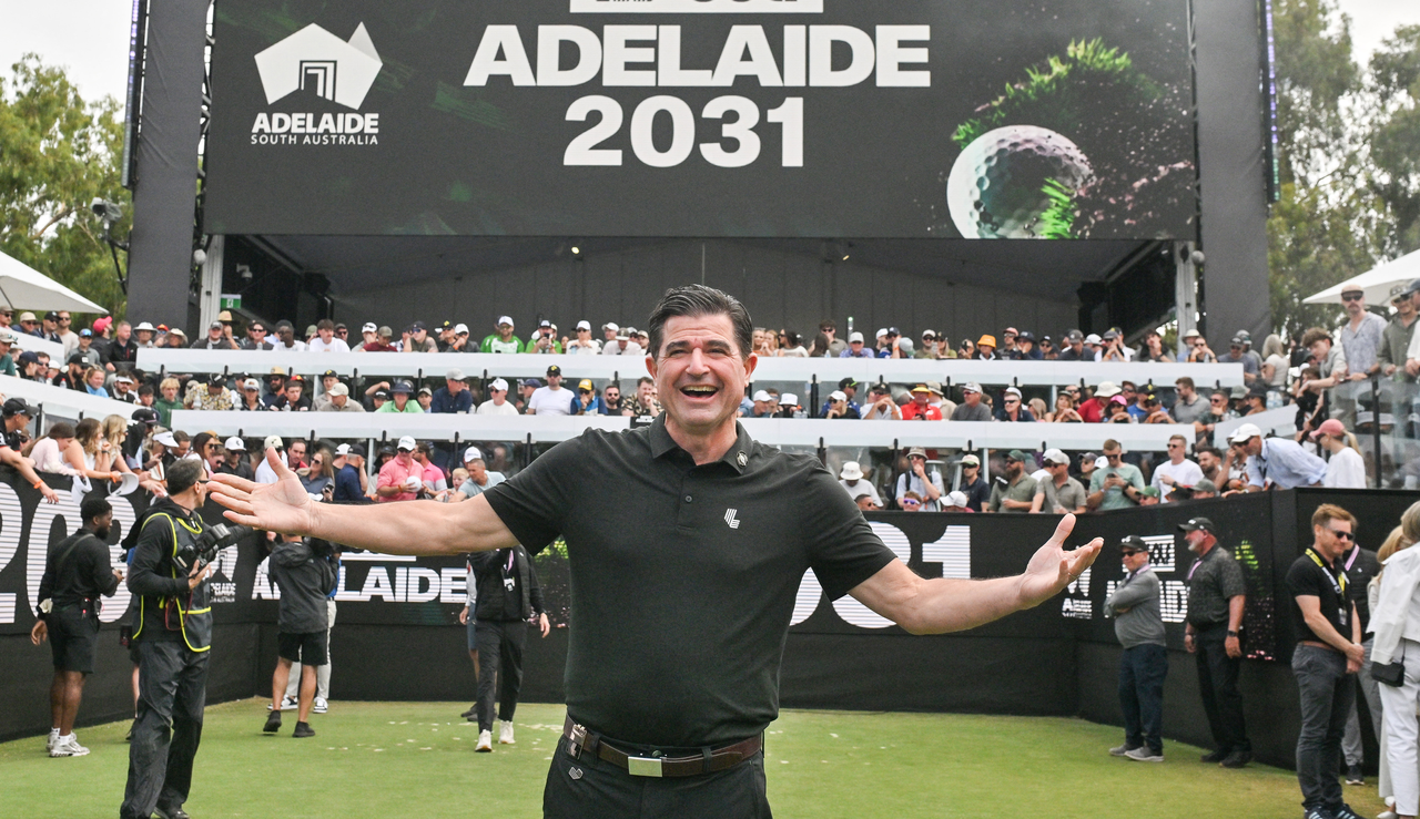 Scott O&#039;Neil poses in front of a LIV Golf board