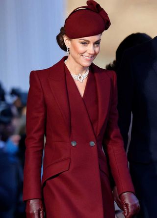 Kate Middleton wearing a burgundy coat