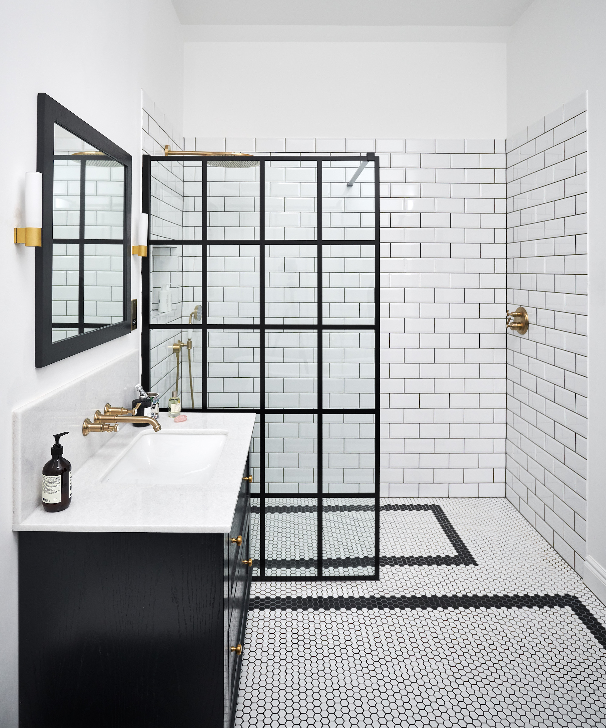 monochrome bathroom with black framed shower screen