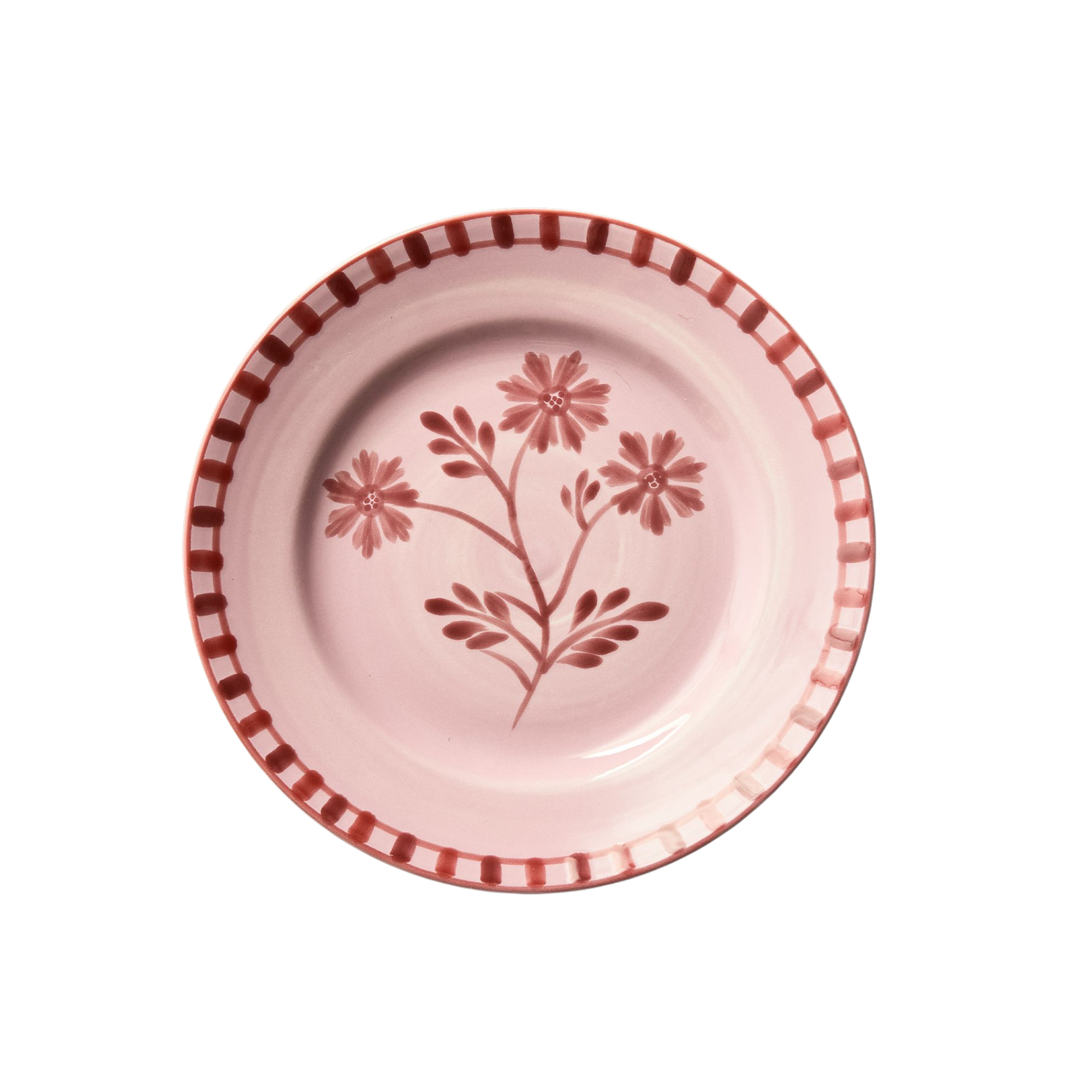 a pink plate with a floral motif
