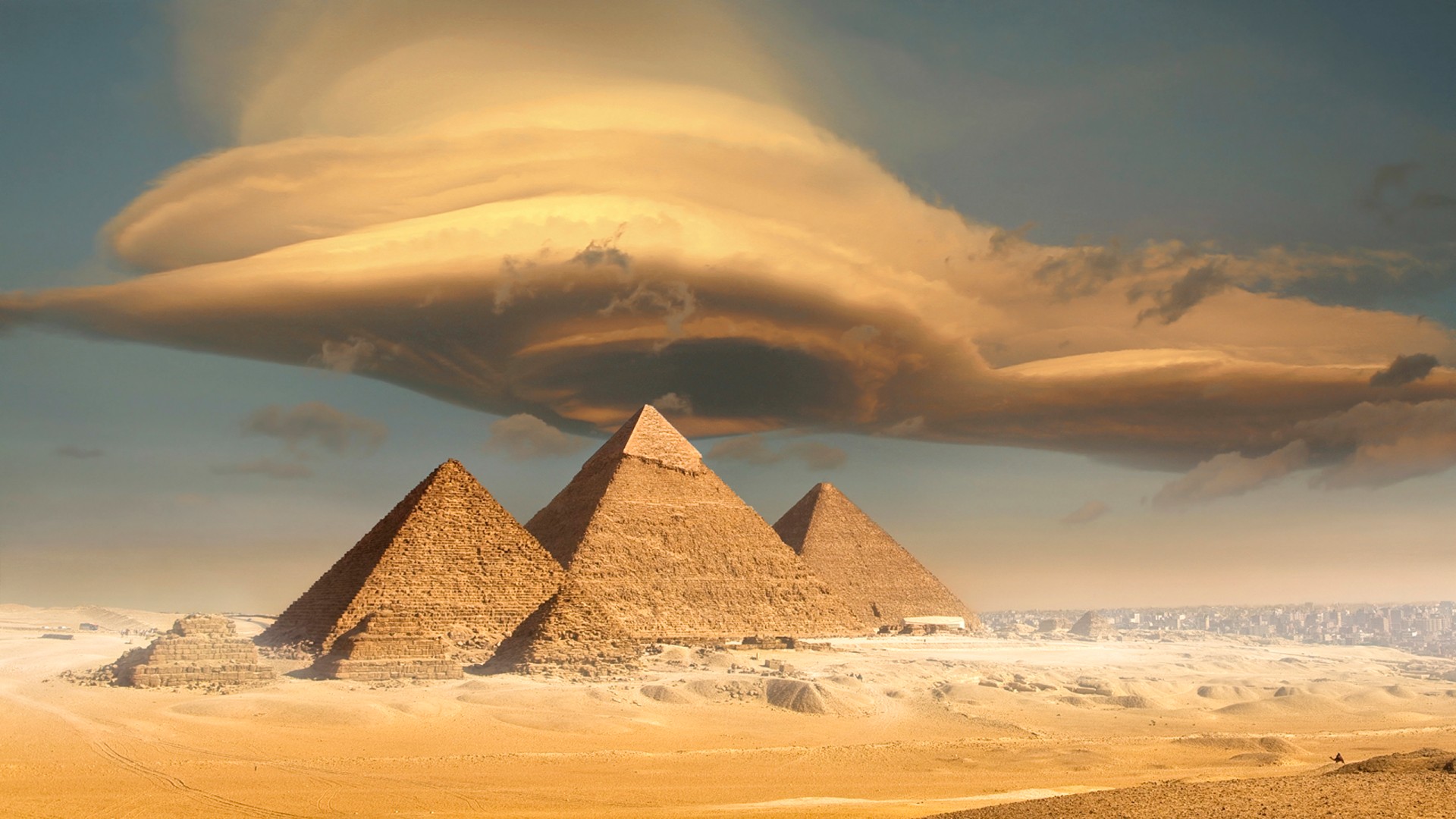 Dramatic storm cloud above pyramids, Giza, Egypt.