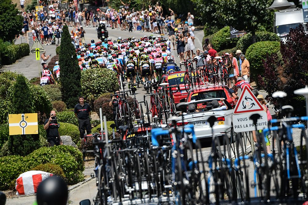 The peloton and caravan during stage 10 at the Tour de France