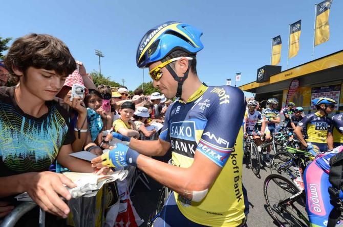 Alberto Contador (Saxo-Tinkoff) signs autographs before the start of stage 6 of the Tour de France.