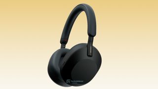 A leaked shot of the Sony WH-1000XM5 headphones in black, on a yellow background